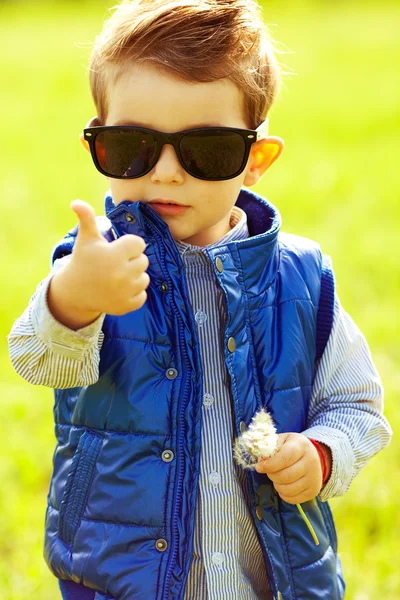 Stylish baby boy with ginger (red) hair in trendy sunglasses and — Stock Photo, Image