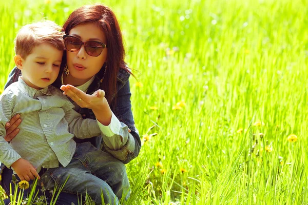 Portrait of fashionable baby boy and his gorgeous mother in tren — Stock Photo, Image