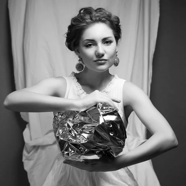 Arty portrait of a fashionable queen-like model holding silver f — Stock Photo, Image