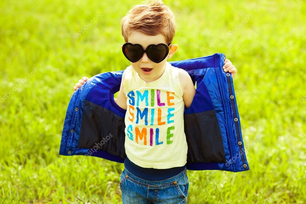 Stylish baby boy with ginger (red) hair in trendy sunglasses (he Stock  Photo by ©avgustino 26970237