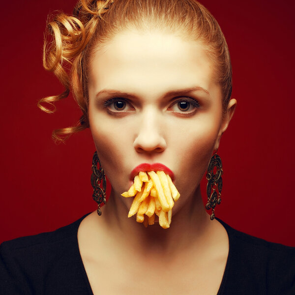 Unhealthy eating. Junk food concept. Arty portrait of fashionabl