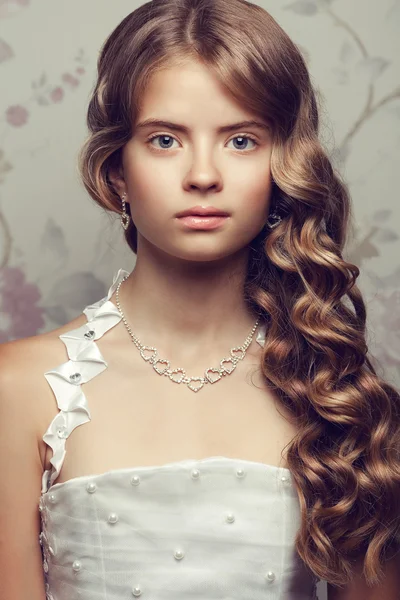 Portrait of a little princess in white vapory classic dress with — Stock Photo, Image