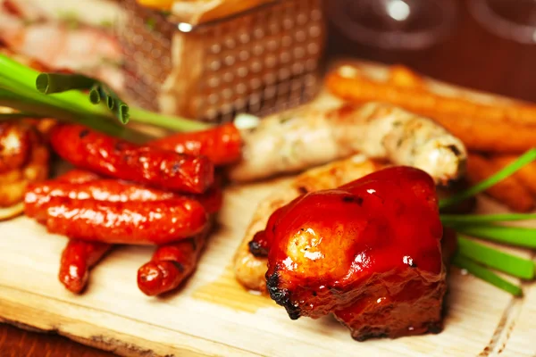 Set of fried meat, cheese and small meat sausages served with sc — Stock Photo, Image