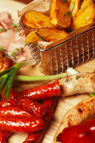 Set of fried meat and small meat sausages served with scallion a — Stock Photo, Image