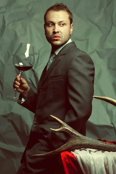 Emotive portrait of handsome stylish man in elegant dark gray su — Stock Photo, Image