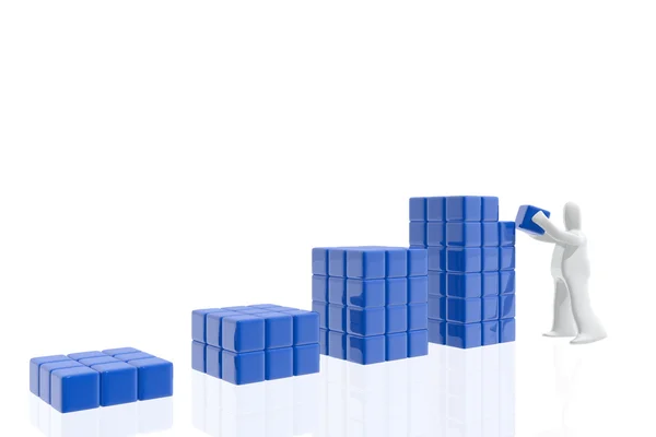 Figure building earnings with cubes — Stock Photo, Image
