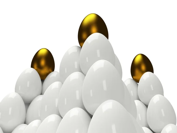 Pyramids of shiny golden and white eggs — Stock Photo, Image