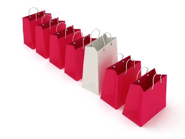 Bílé Nákupní taška v řadě crimson sáčků — Stock fotografie