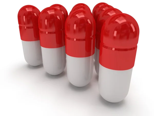 Pilules médicales 3d se tenir comme une pyramide sur blanc — Photo