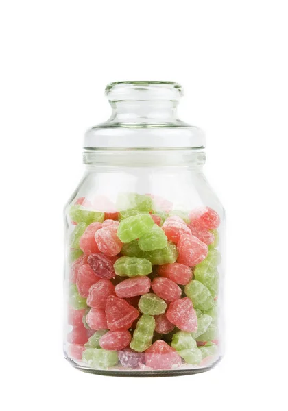 Glass Jar of candy sweets over white — Stock Photo, Image