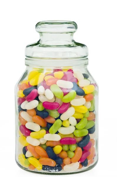 Jelly beans en un frasco de vidrio de caramelo Fotos de stock