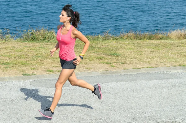 Woman running fast on summer — Stock Photo, Image