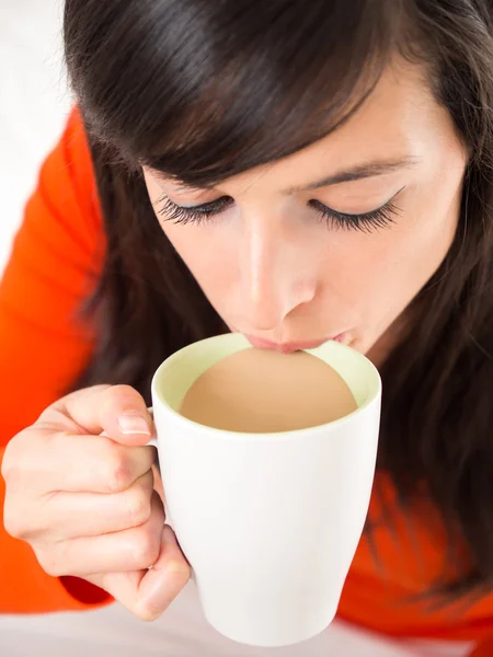 Sipping hot coffee — Stock Photo, Image