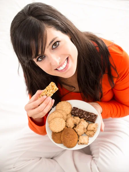 Eating sweet food in bed — Stock Photo, Image