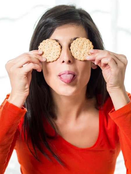 Woman taunting diet with crackers — Stock Photo, Image