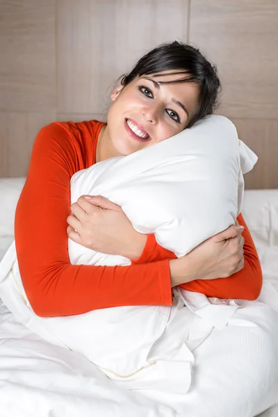 Comfortable happy woman in bed Stock Picture