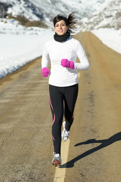 Winter running woman road — Stock Photo, Image