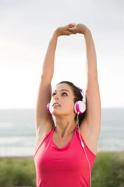 Woman on summer fitness workout stretching arms — Stock Photo, Image