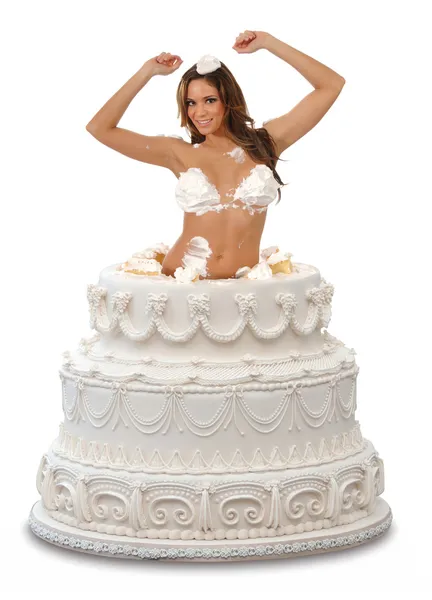 Meisje knallen uit een cake — Stockfoto