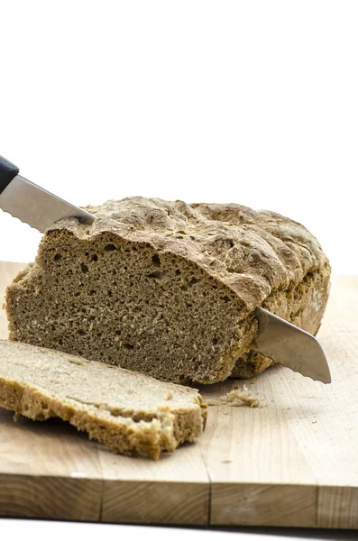 Cutting a bread — Stock Photo, Image