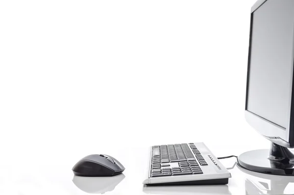 Computer on a white table — Stock Photo, Image