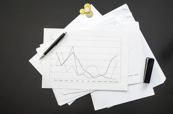 Documents on a black office desk — Stock Photo, Image