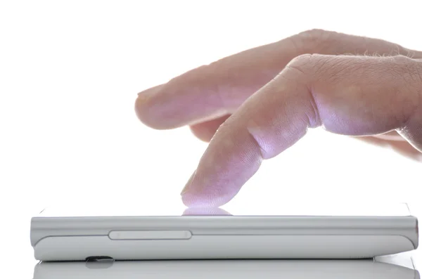 Close up of a finger touching smart phone — Stock Photo, Image