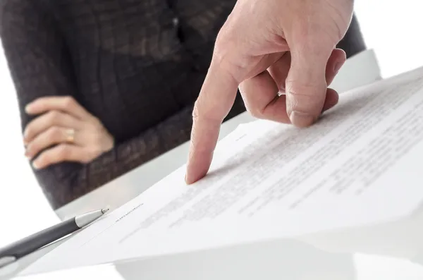 Hand showing a woman to sign a paper — Stock Photo, Image