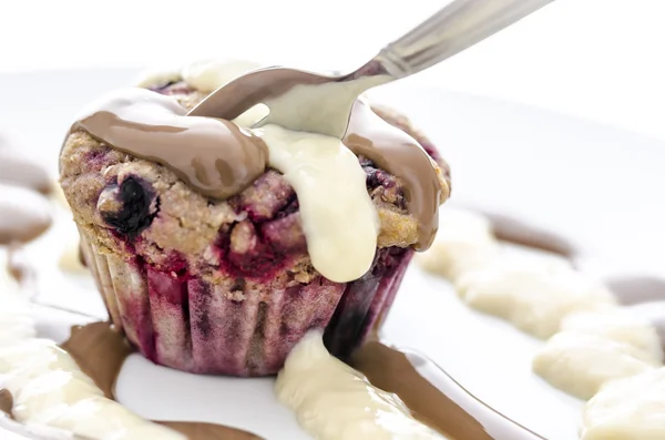 Closeup of eating a berry muffin — Stock Photo, Image