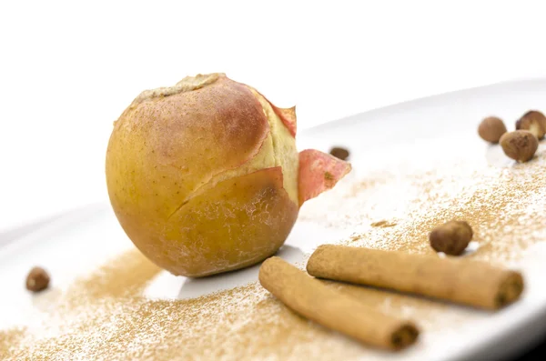 Baked apple on a decorated plate — Stock Photo, Image