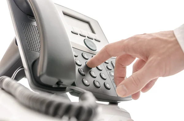 Operator dialing a phone number Stock Photo