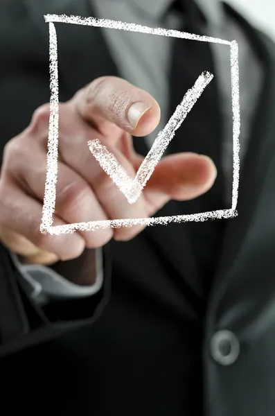 Business man making a checkmark — Stock Photo, Image