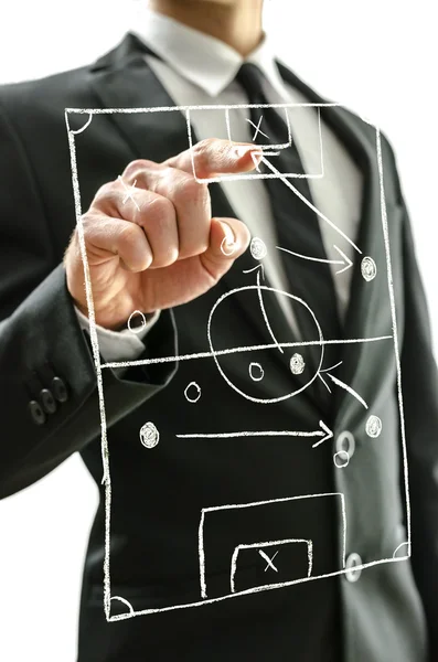 Man pointing at football field on a virtual screen — Stock Photo, Image