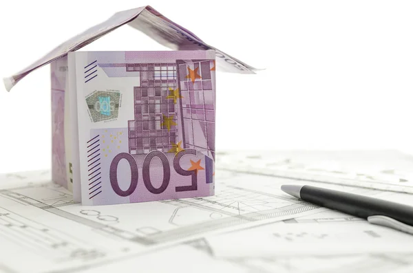 Construction plan with house made of money on it — Stock Photo, Image