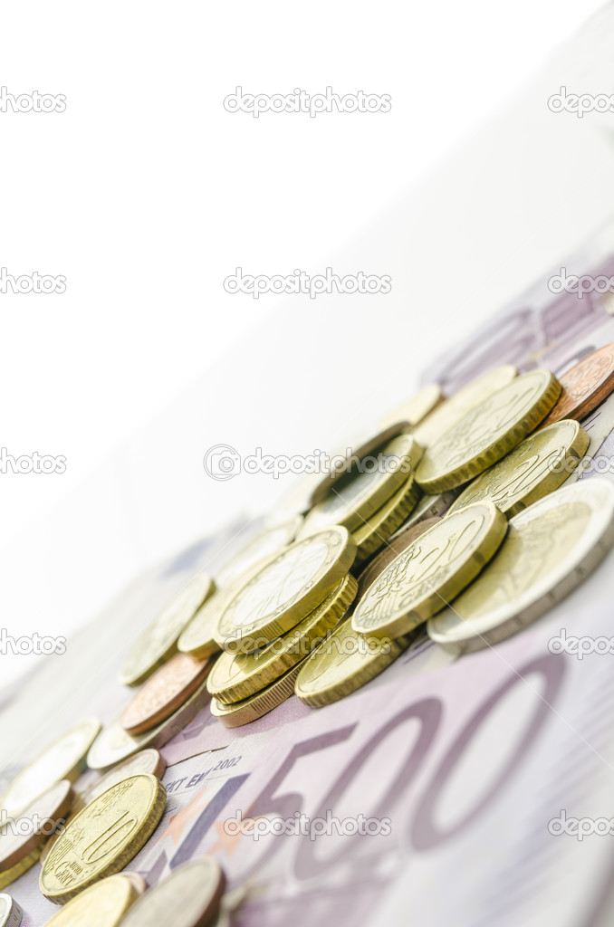 Euro coins on banknotes