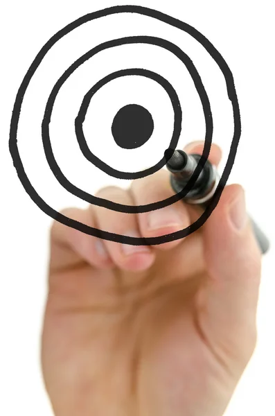 Male hand drawing target on white board — Stock Photo, Image