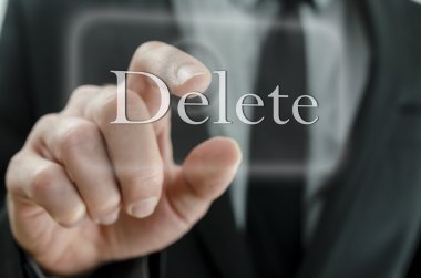 Businessman touching Delete button clipart