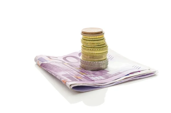 Stack of Euro coins on banknotes — Stock Photo, Image