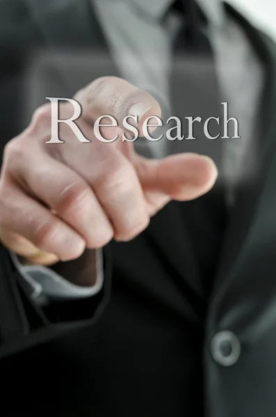 Manager hand pointing at Research button — Stock Photo, Image