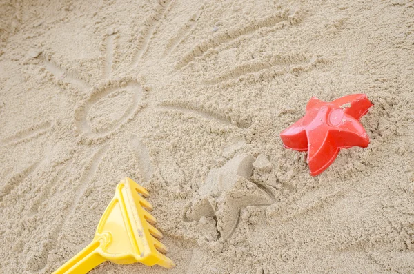 Sun drawn in sand — Stock Photo, Image