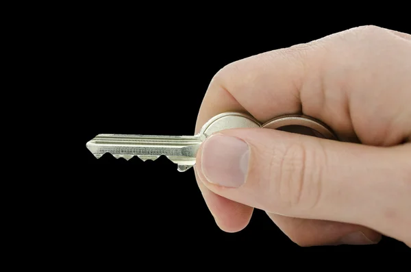 Male hand holding house key — Stock Photo, Image