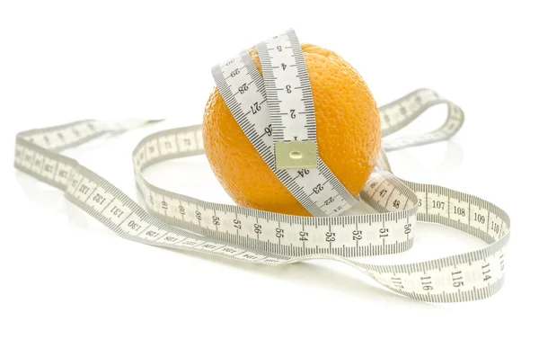 Measuring tape wrapped around orange — Stock Photo, Image