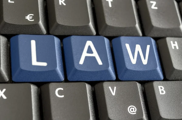 Word LAW written on computer keyboard — Stock Photo, Image