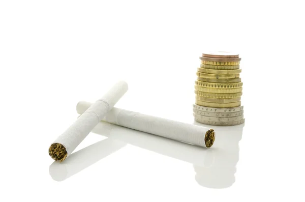 Cigarettes and Euro coins — Stock Photo, Image