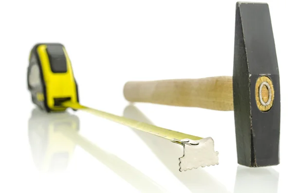 Tape measure and hammer — Stock Photo, Image