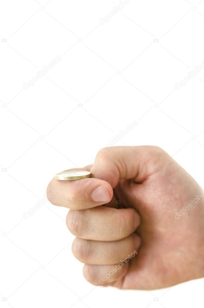 Male hand flipping a coin. Isolated over white background. Shallow depth of field.