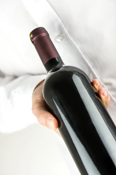 Offering a bottle of wine — Stock Photo, Image