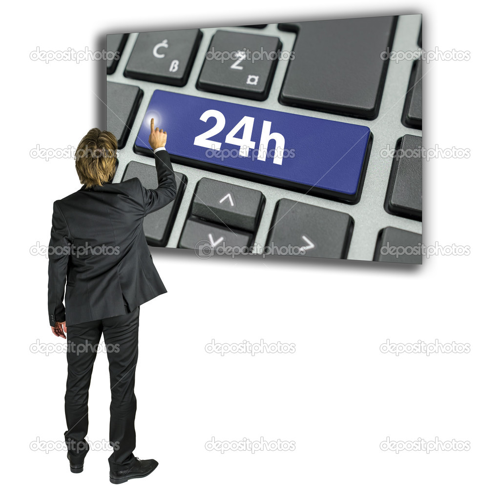 Businessman activating a 24h key on a keyboard