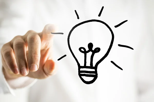 Man with a bright idea - a light bulb — Stock Photo, Image