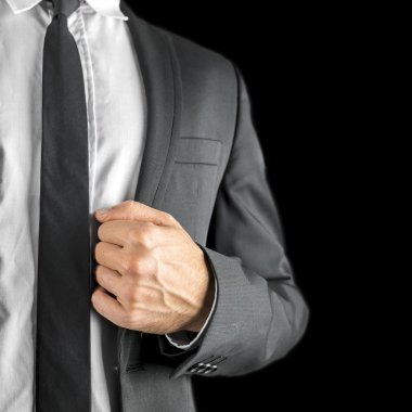onun ceket yaka tutarak işadamı